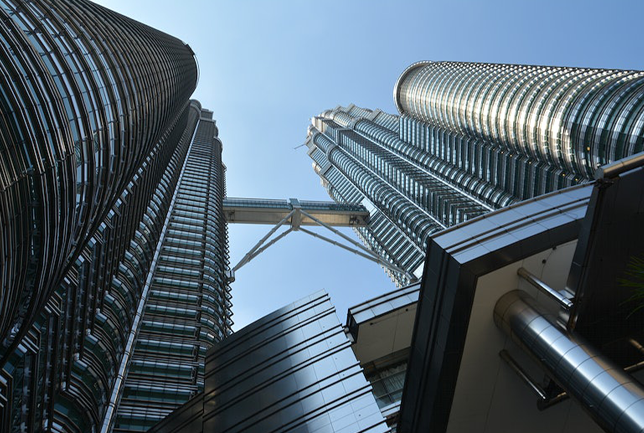 The Petronas Towers, also known as the Petronas Twin Towers and the KLCC Twin Towers, are 88-storey supertall skyscrapers in Kuala Lumpur, Malaysia. At 451.9 metres (1,483 feet), they are the world's tallest twin skyscrapers. Between 1998